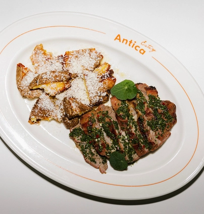 Свинний ошийок з картоплею - ANTICA Eatery 